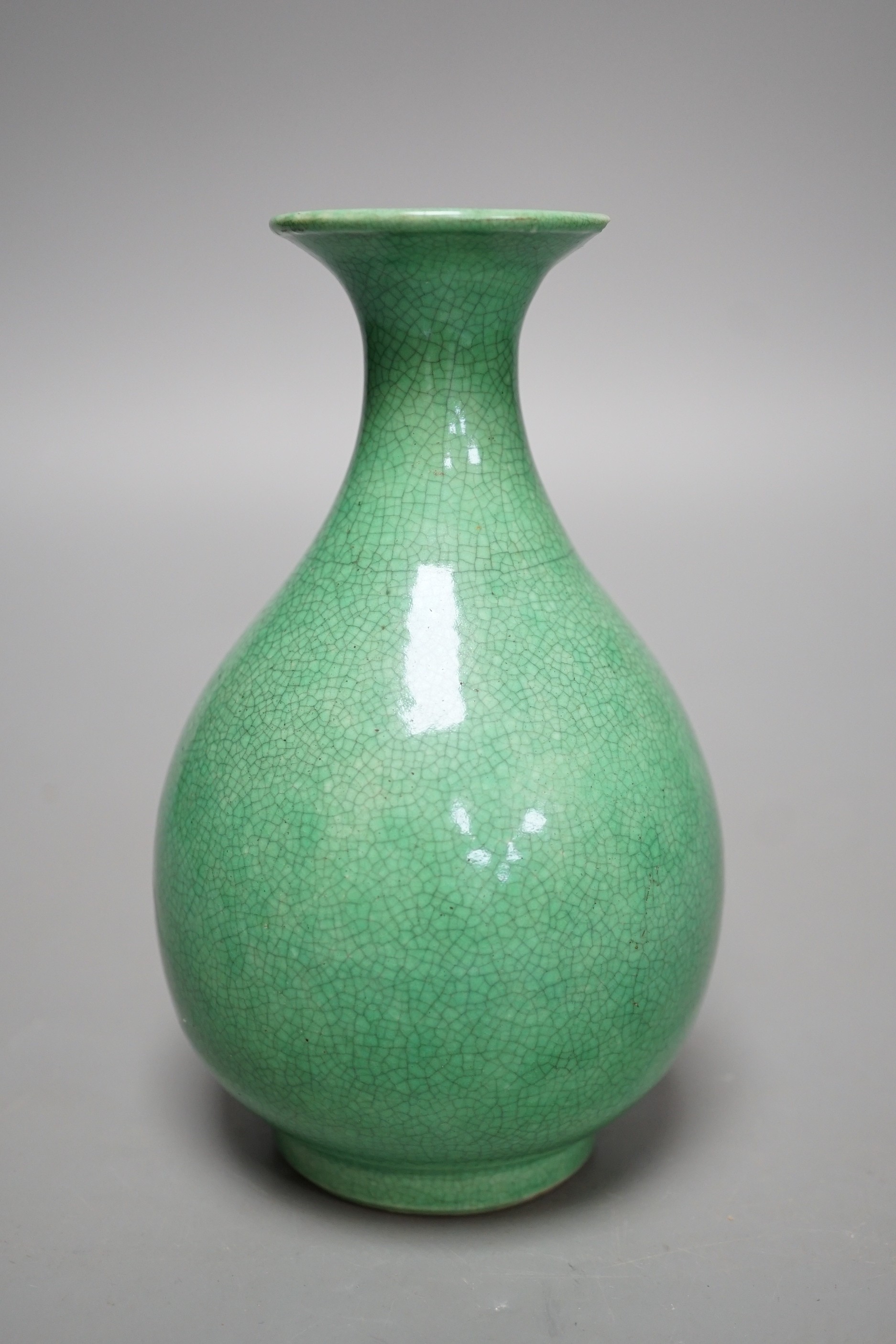 An early 20th century Chinese green crackle glazed vase (a.f.). 17cm.